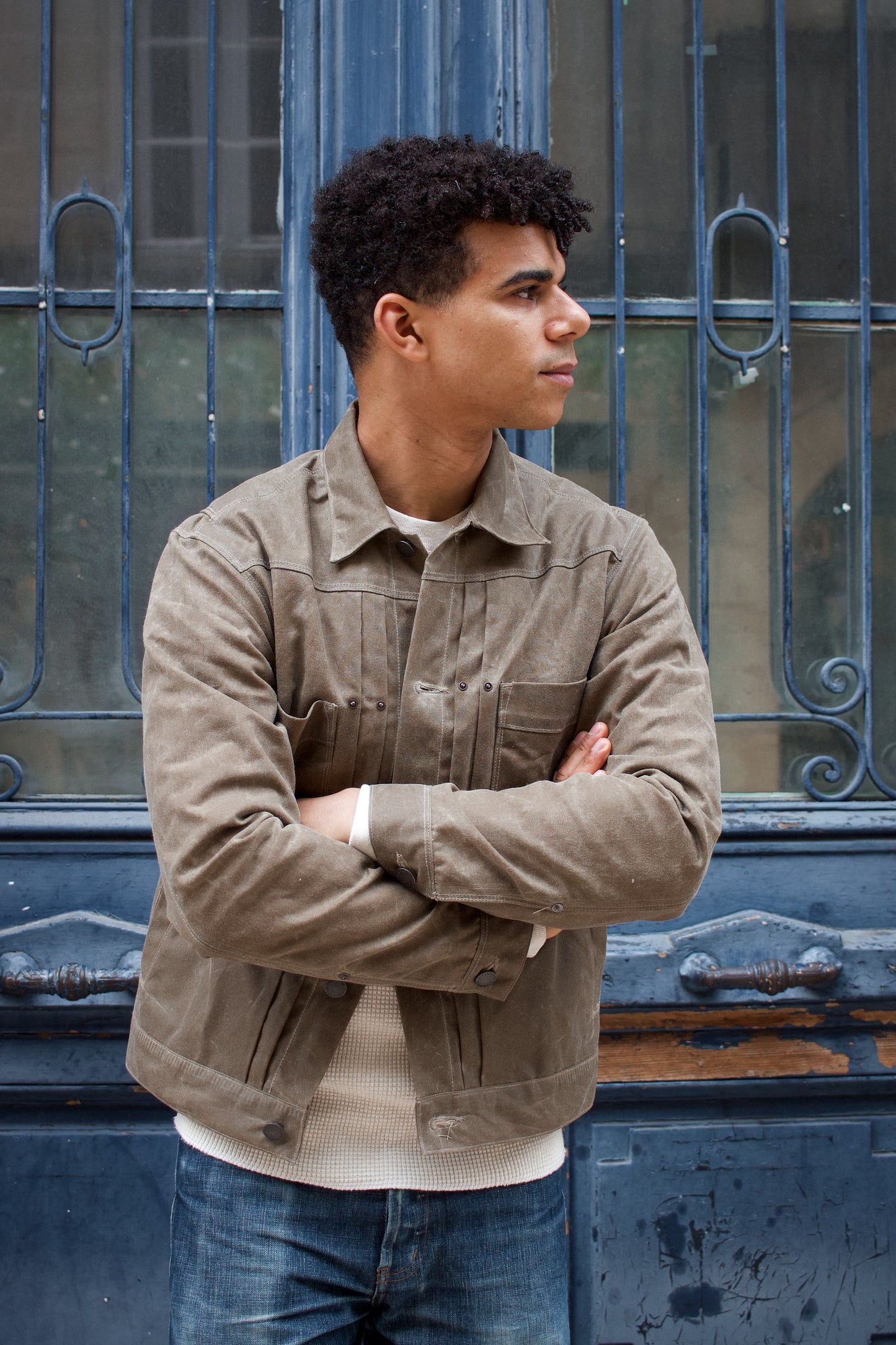 Lionel is wearing the RJ1 waxed jacket from FREENOTE CLOTH, made in USA with a Japanese fabric lining. Built to last