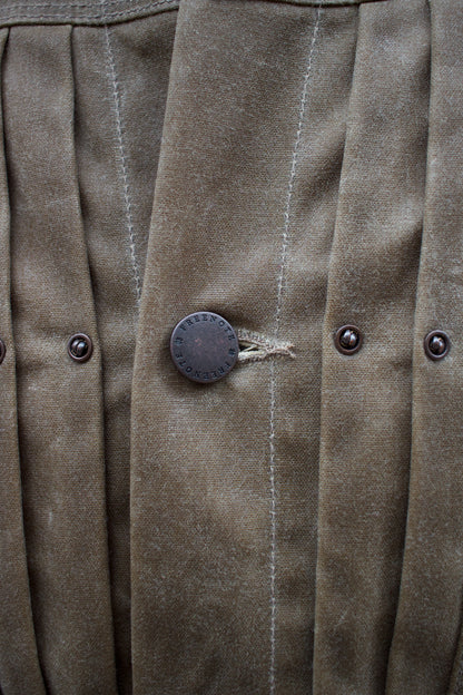 Detail of the hammered buttons on the riders jacket from Freenote Cloth